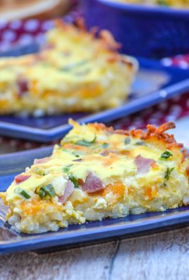 slices of ham and cheese hash brown crusted quiche on blue square plates