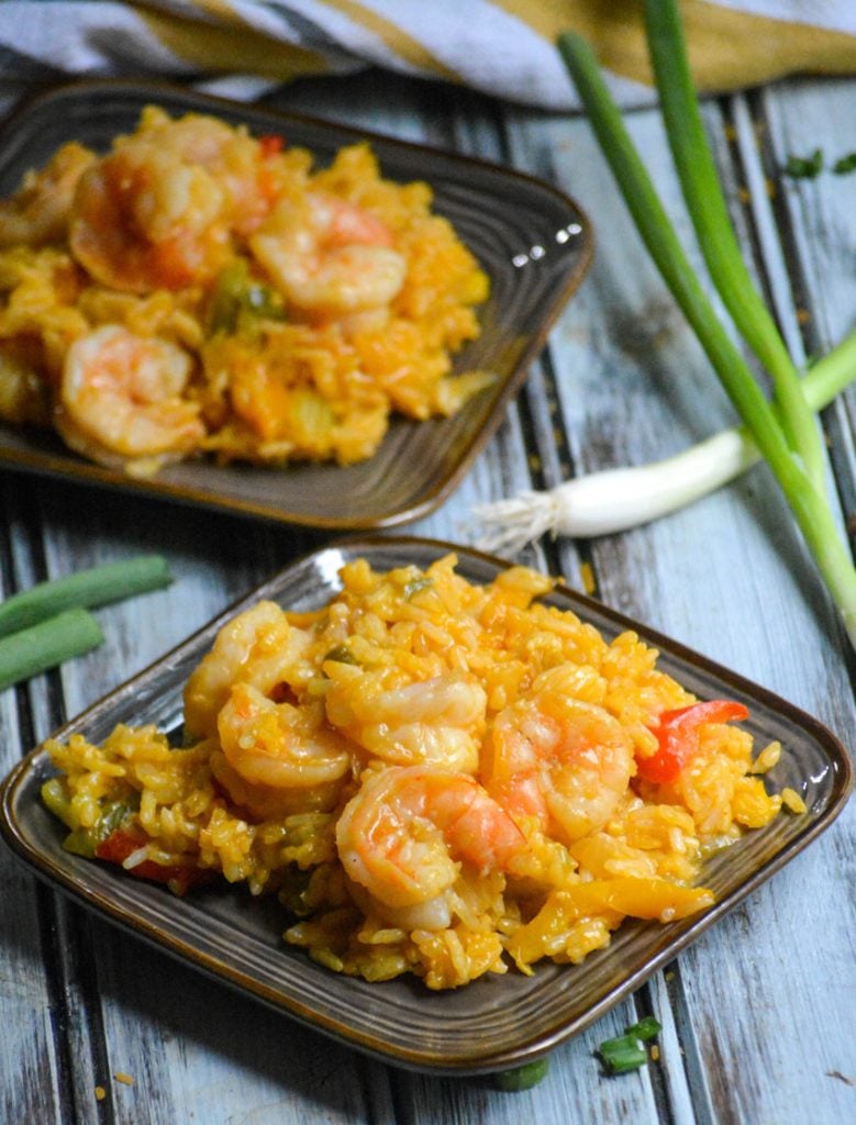 shrimp & rice casserole served on two small brown plates