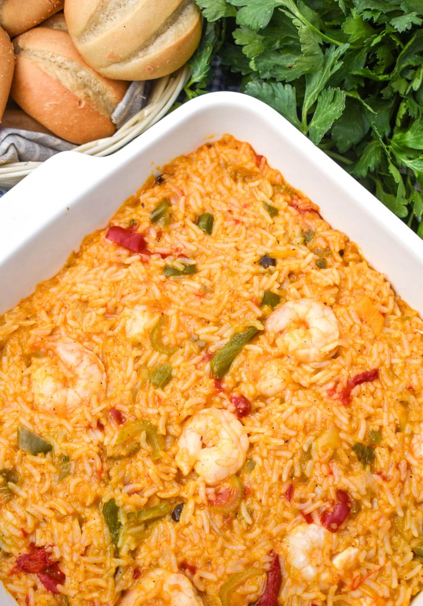 shrimp and rice casserole in a white square baking dish