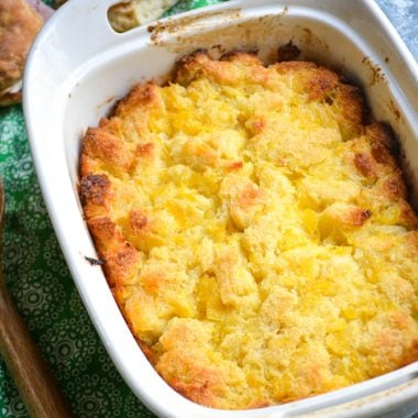 baked scalloped pineapple in a white casserole dish