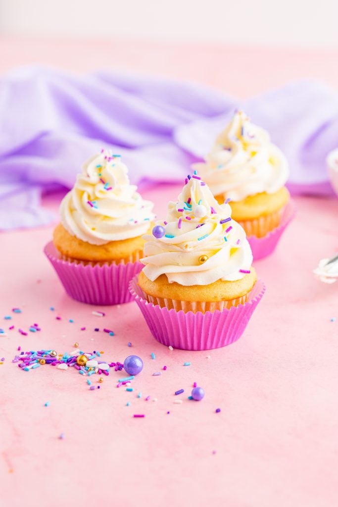 cupcakes piled high with swirls of fluffy cake decorating frosting