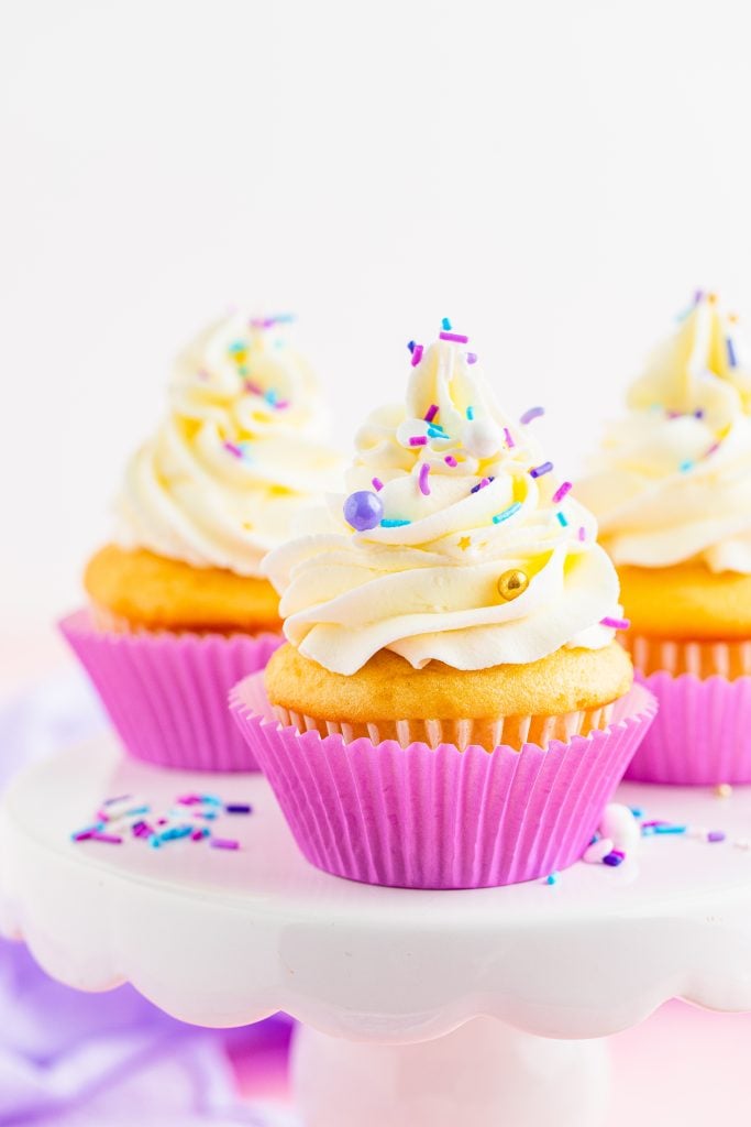 cupcakes piled high with swirls of fluffy cake decorating frosting