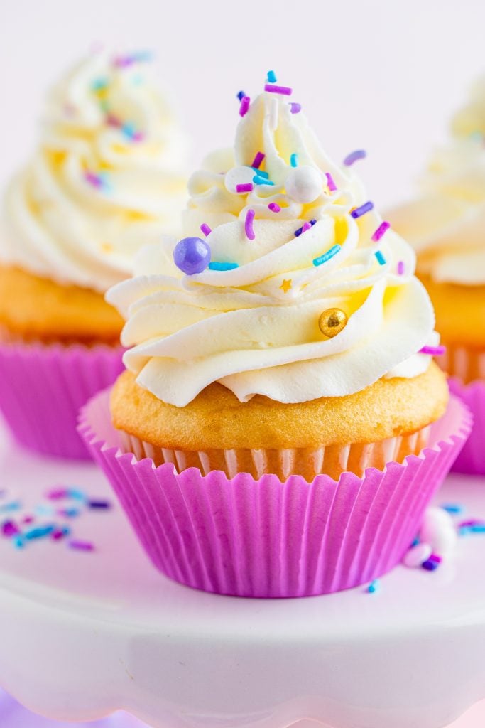 cupcakes piled high with swirls of fluffy cake decorating frosting