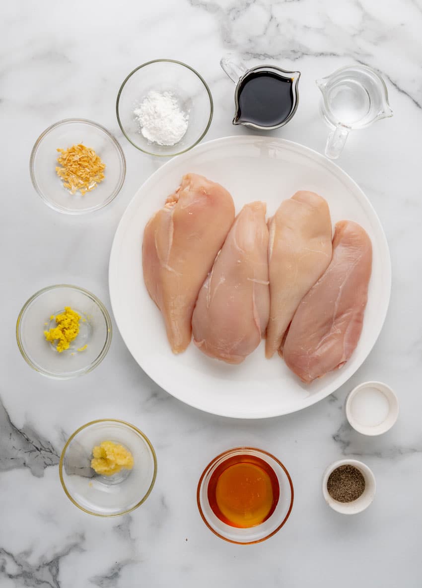 an overhead image showing the measured ingredients needed to make grilled teriyaki chicken breasts