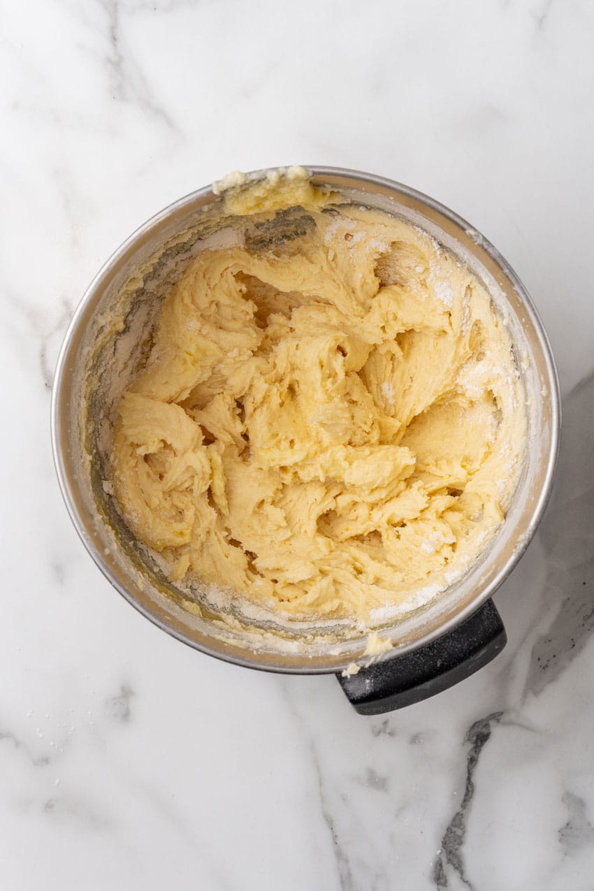 lemon yogurt cake batter in a large metal bowl