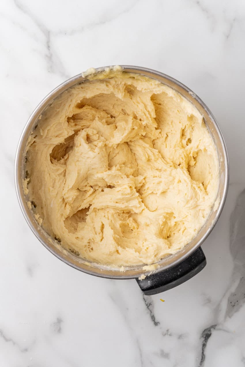 lemon yogurt cake batter in a large metal bowl