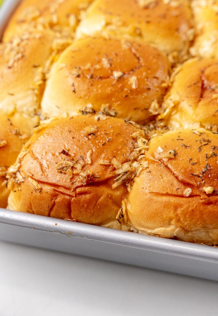 baked tuna melt sliders in a square metal baking dish