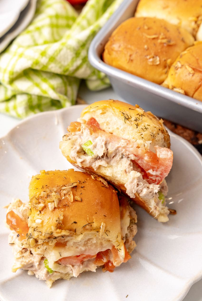 two tuna melt sliders on a small white plate