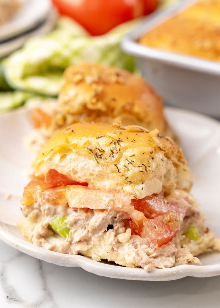 two tuna melt sliders on a small white plate