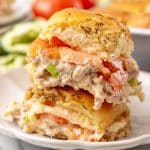 two tuna melt sliders on a small white plate