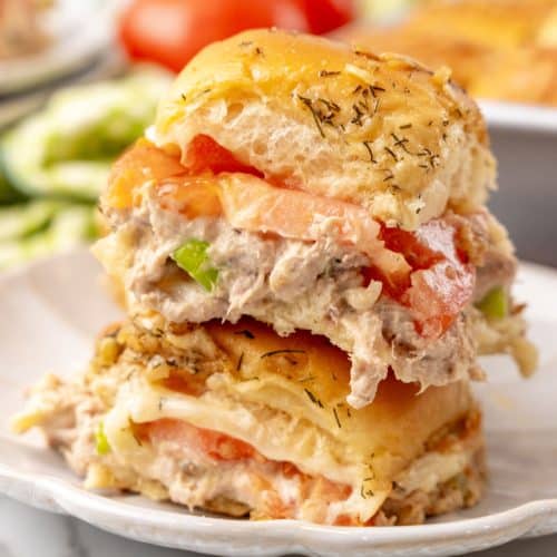 two tuna melt sliders on a small white plate
