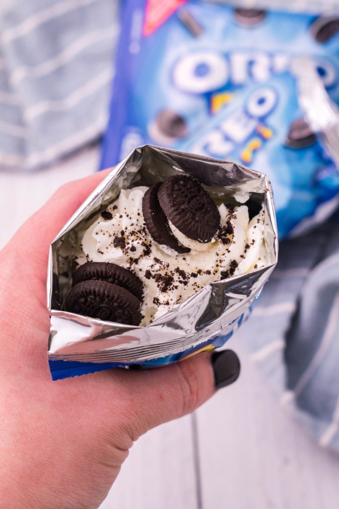 mini oreo cookie snack bag opened & stuffed and shown as a walking dessert