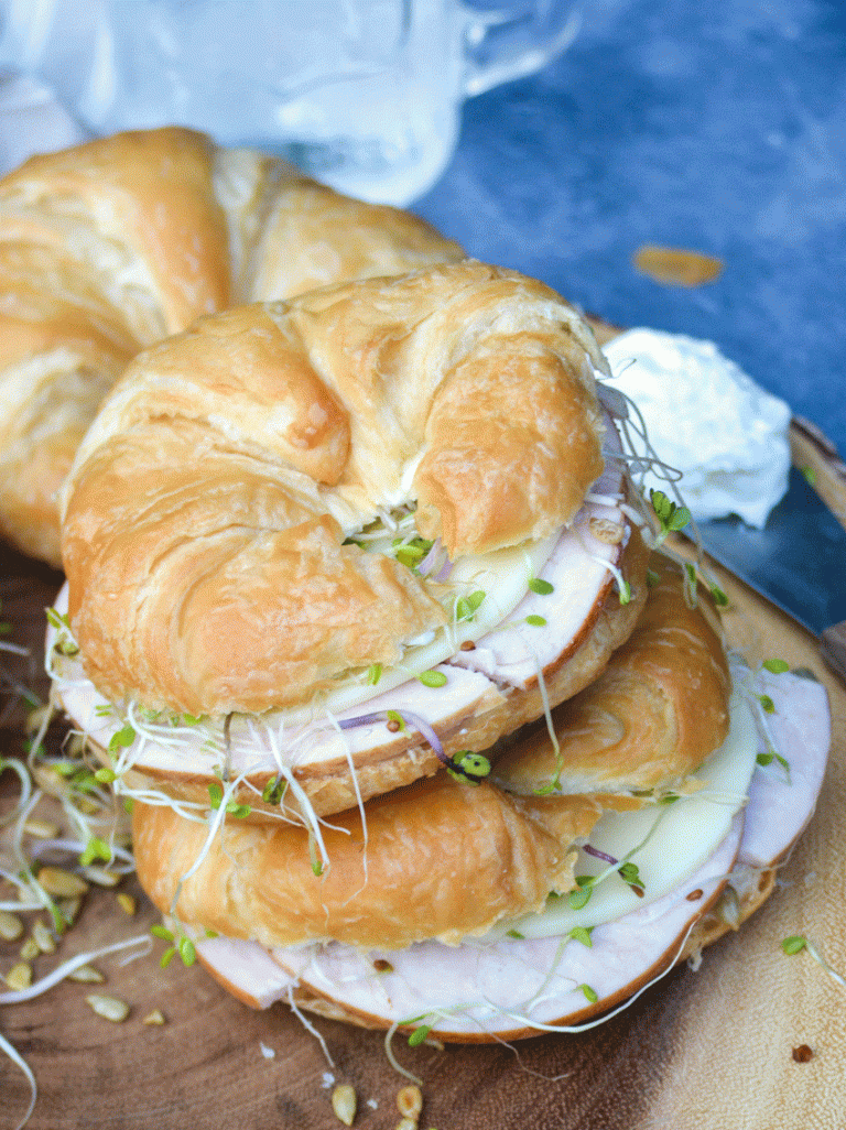 two nutty bird sandwiches stacked on top of each other