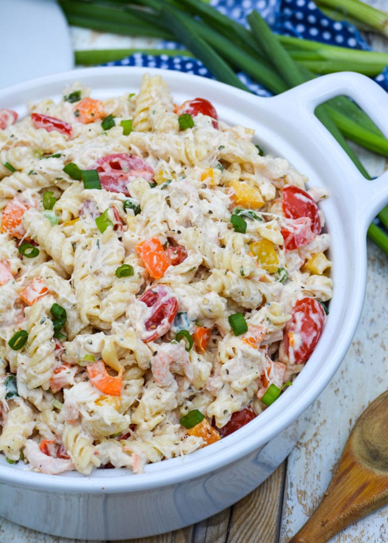 creamy seafood pasta salad in a white ceramic bowl