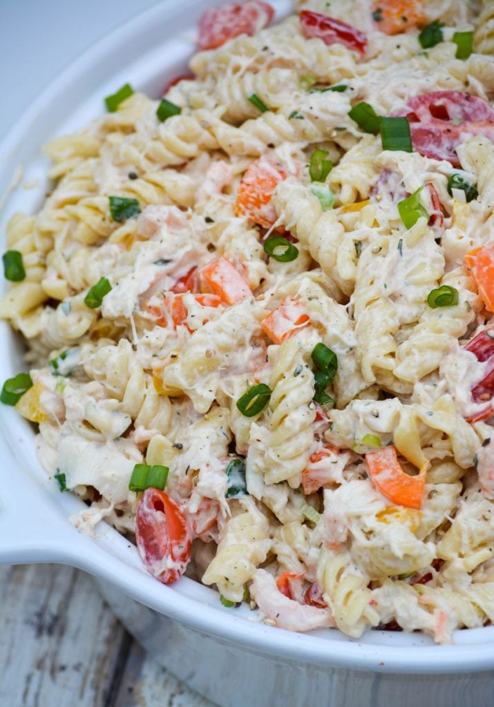 creamy seafood pasta salad in a white ceramic bowl