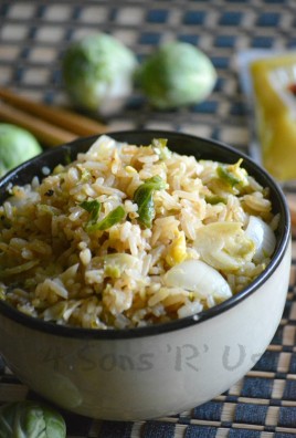 an asian style bowl filled with brussels sprout fried rice