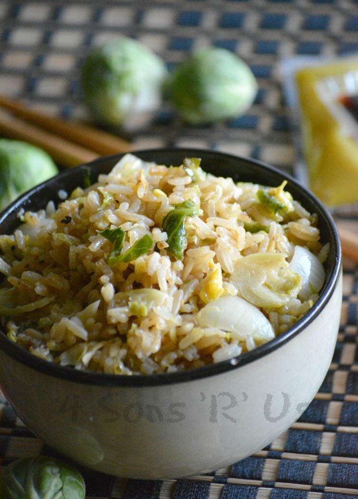 an asian style bowl filled with brussels sprout fried rice