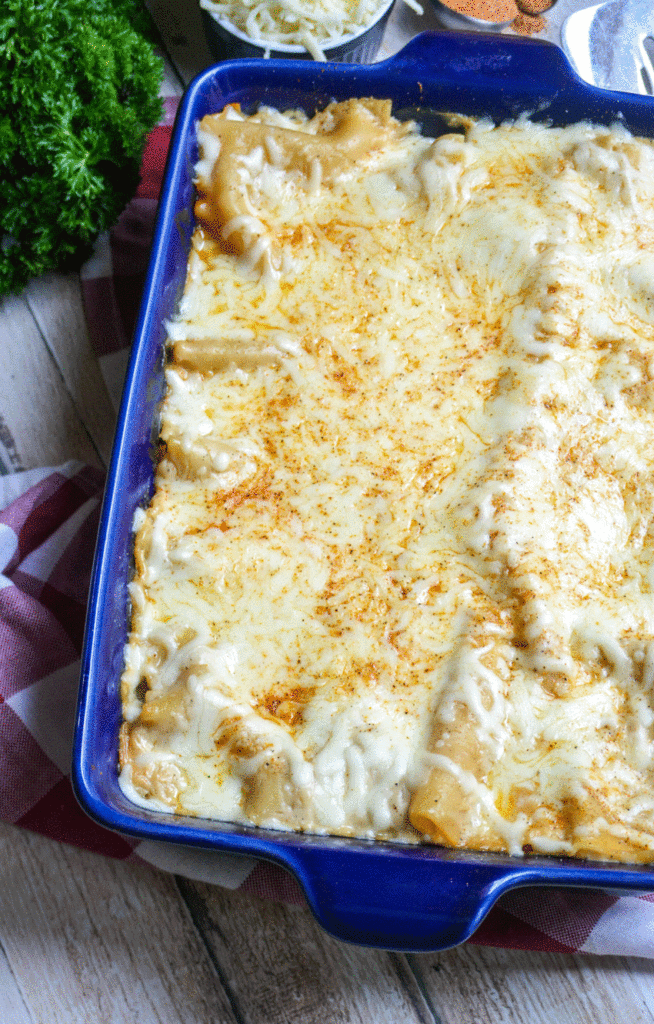 cheesy Cajun lasagna in a blue casserole dish