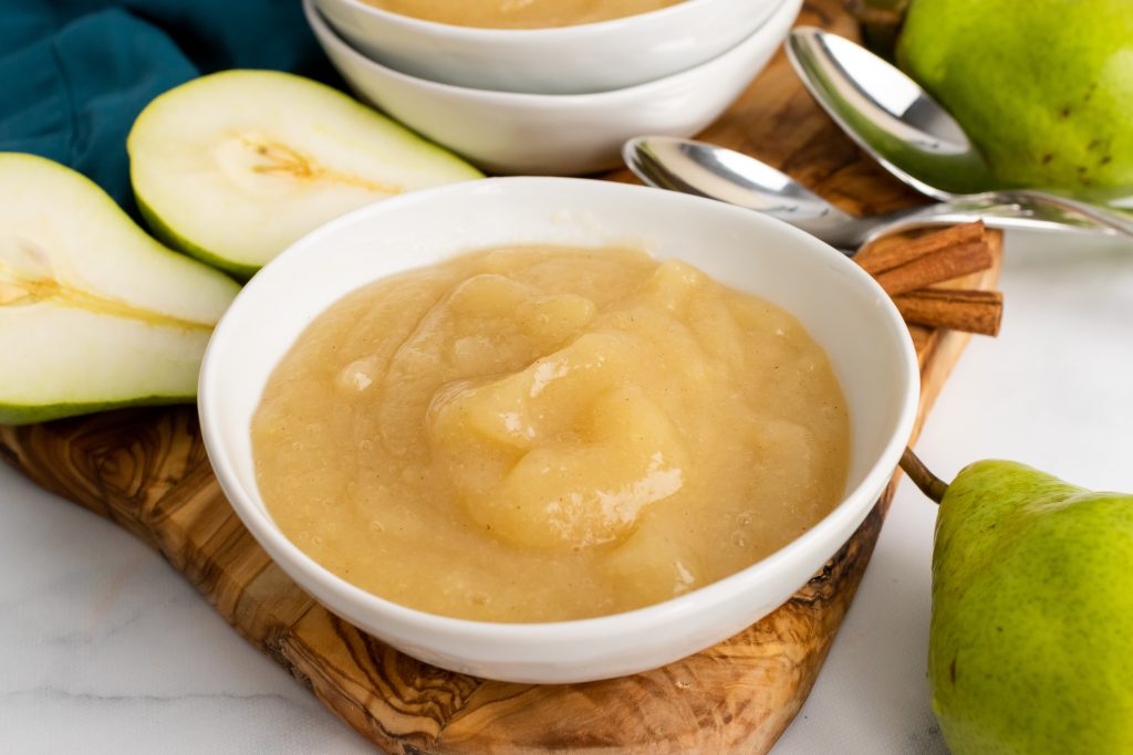 instant pot pear sauce served in a shallow white bowl