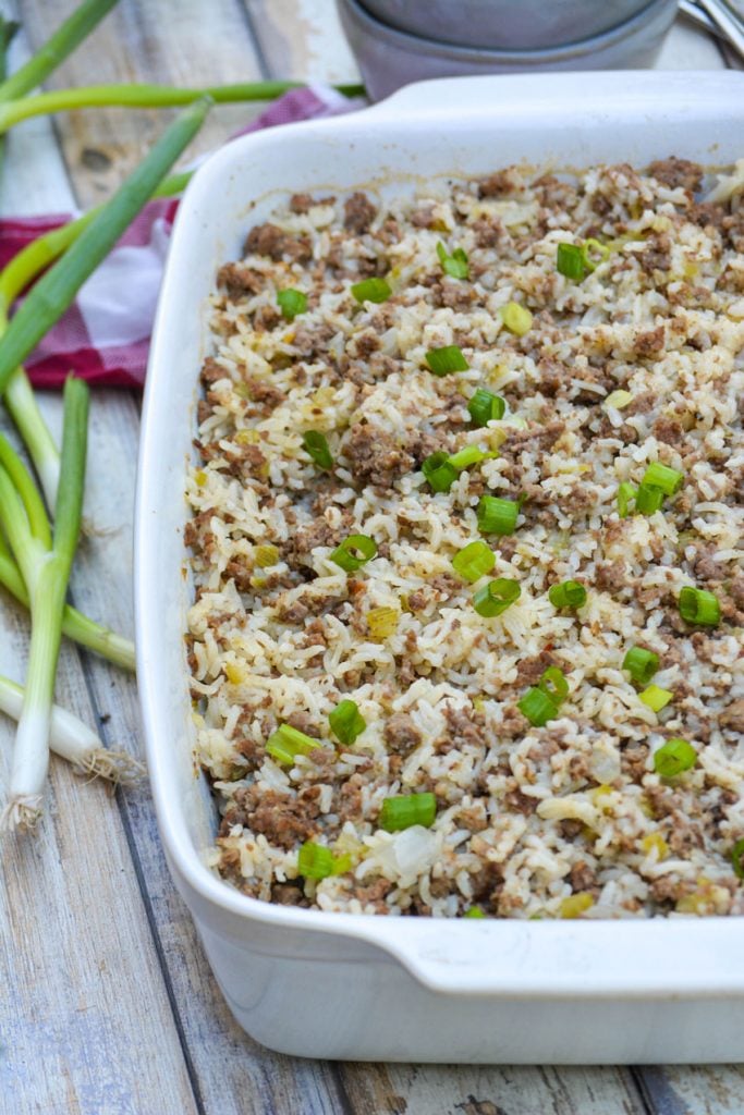 ground beef, sausage, and rice casserole in a 9x13" white casserole dish