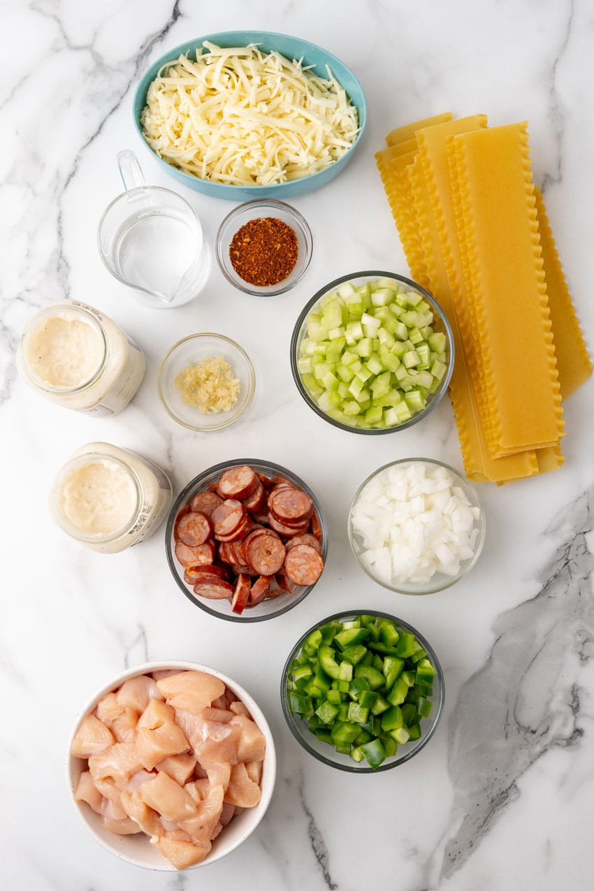 an overhead image showing the measured ingredients needed to make a cajun lasagna