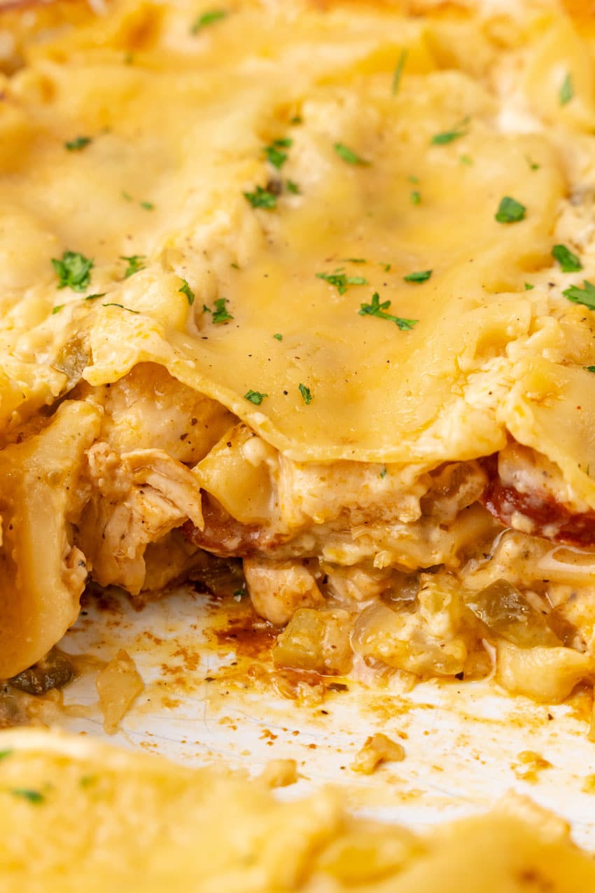 a close up of a sliced cajun lasagna showing the layered filling inside