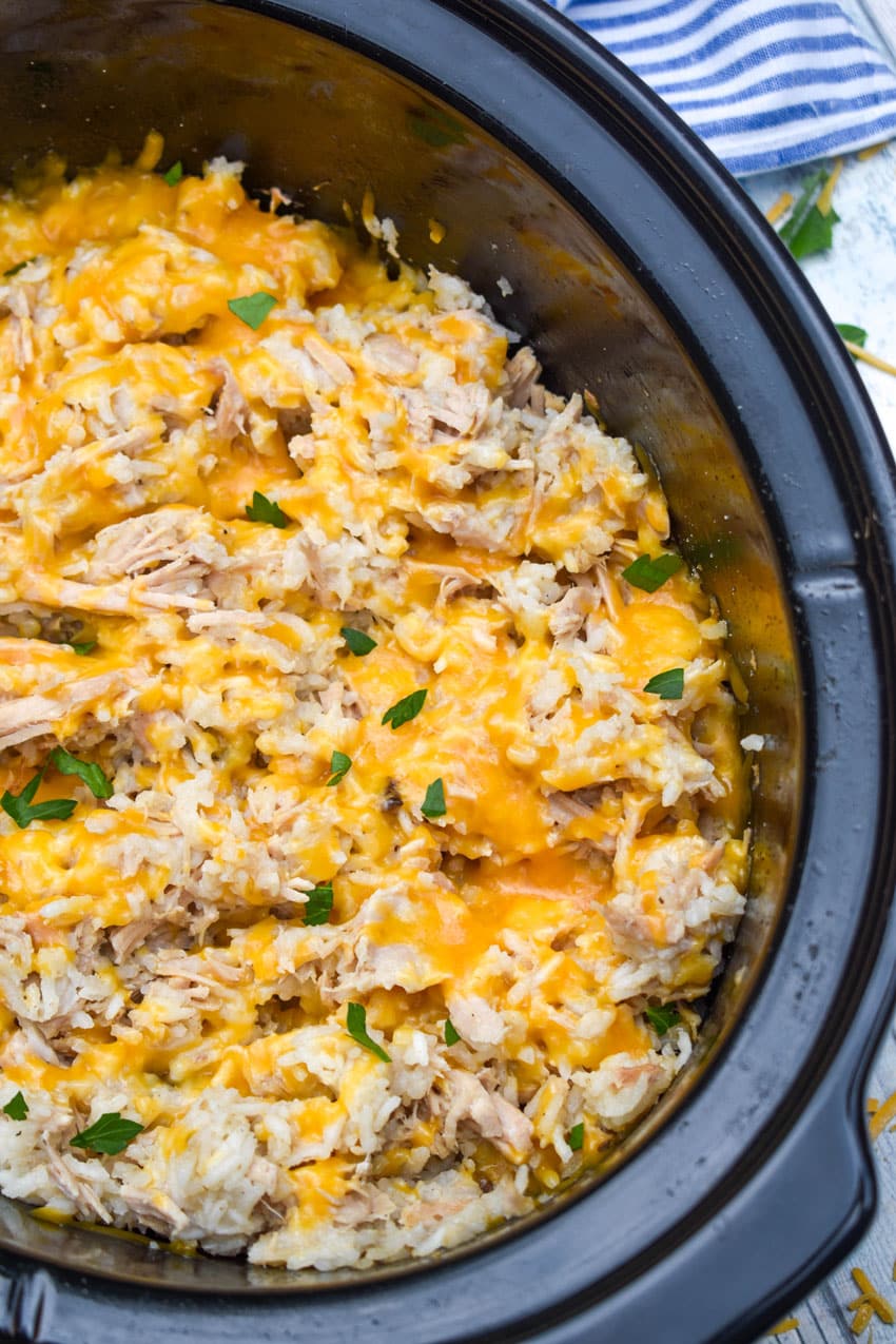 slow cooker pork and rice in a black crock