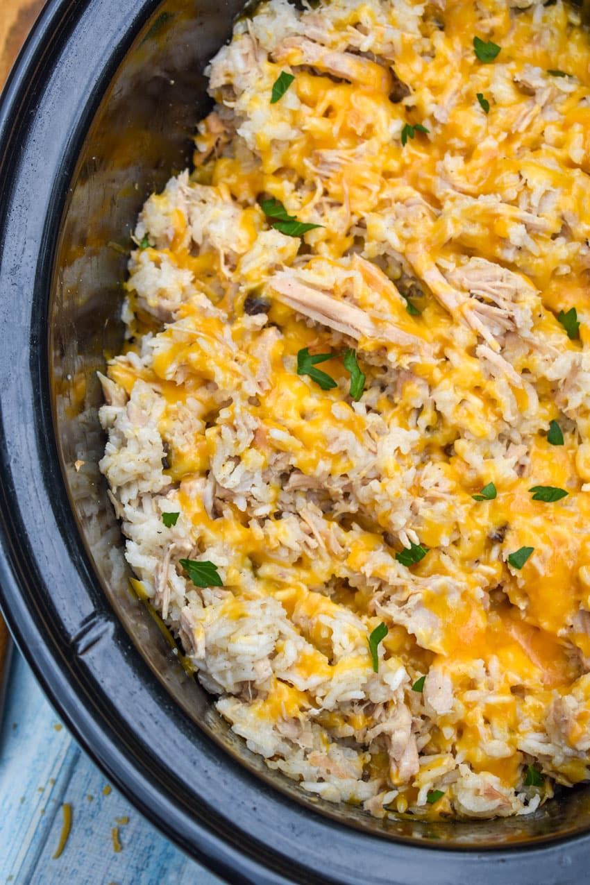 slow cooker pork and rice in a black crock