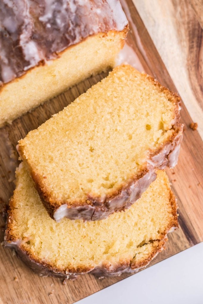 slices of apple cider pound cake on a wooden cutting board