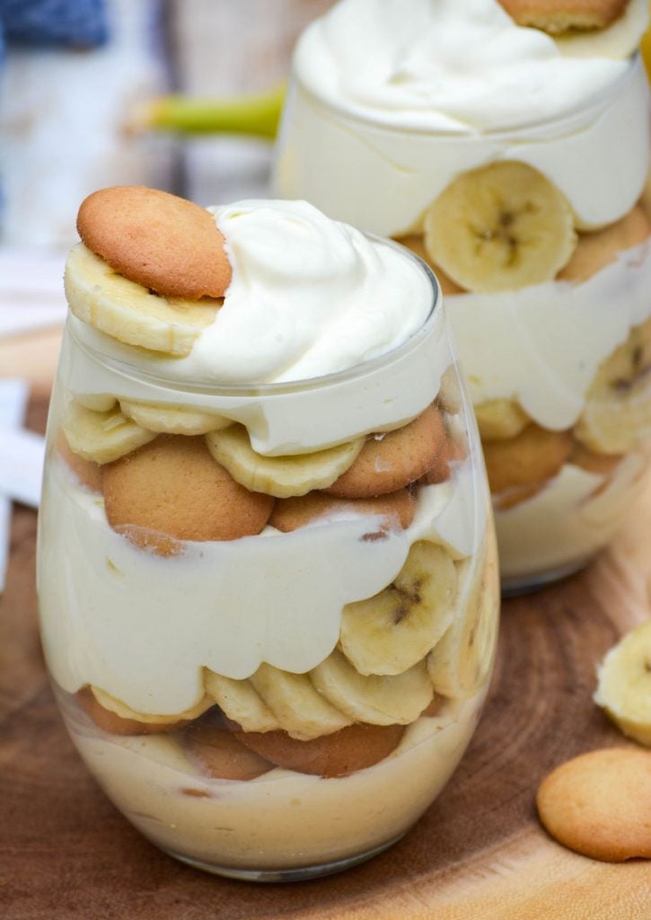 Magnolia bakery banana pudding recipe layered in glasses topped with sliced bananas and vanilla wafers