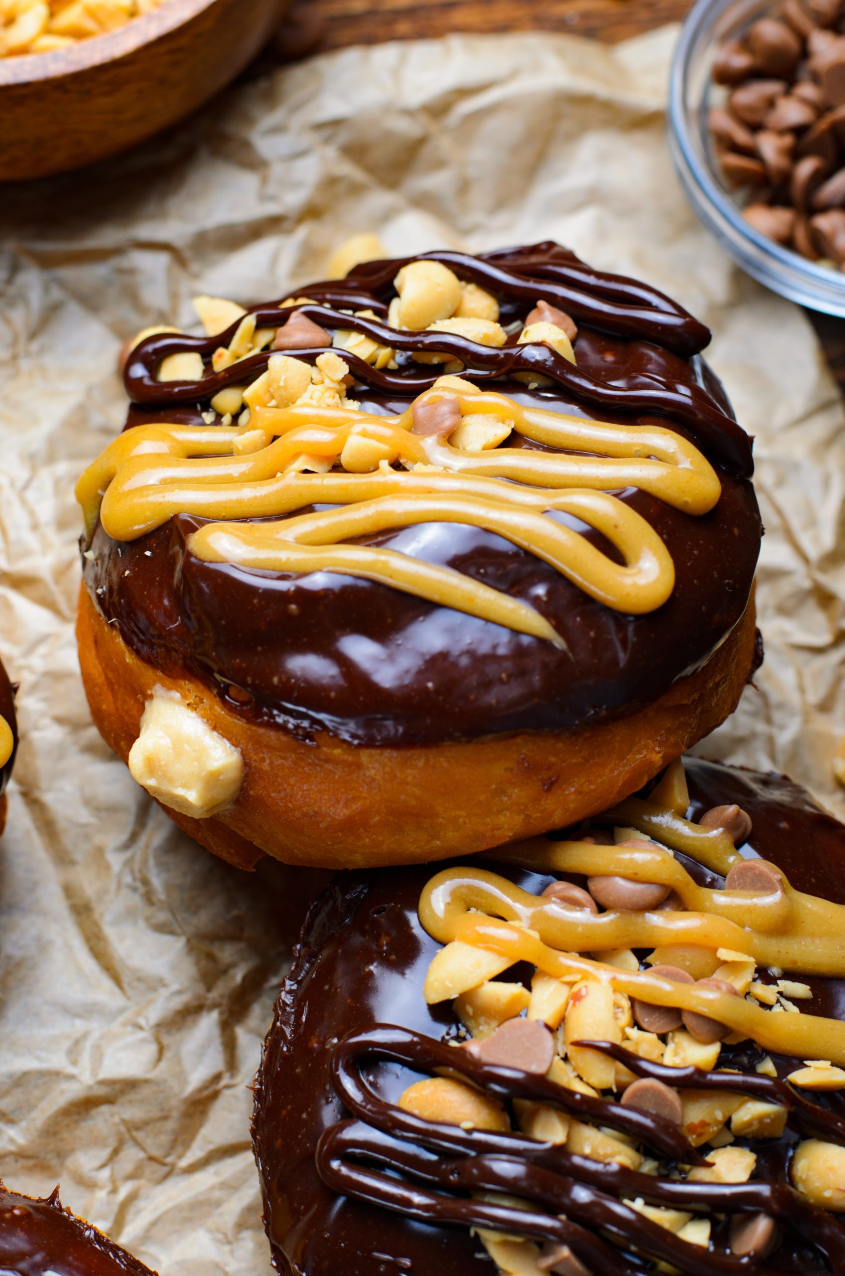 reese's stuffed donuts on a crumpled sheet of brown parchment paper