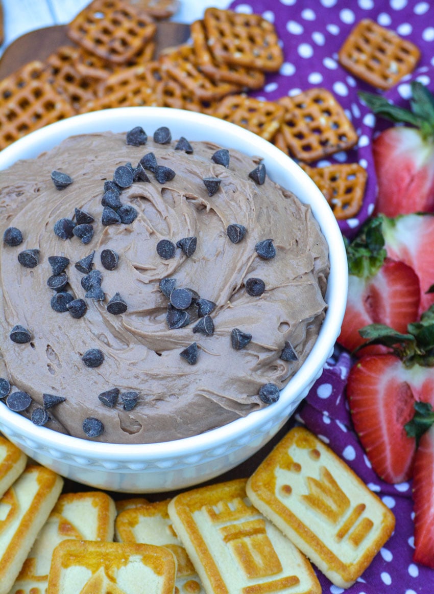 brownie batter dip in a white bowl sprinkled with chocolate chips