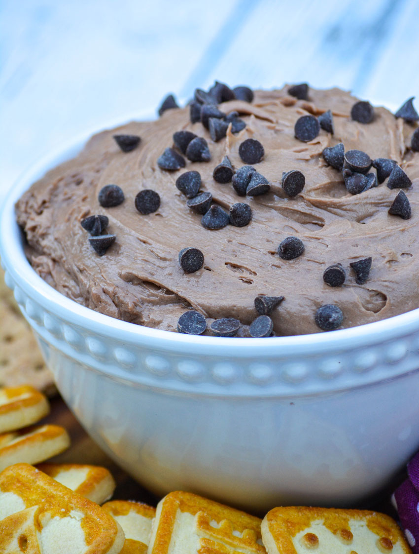 brownie batter dip in a white bowl sprinkled with chocolate chips