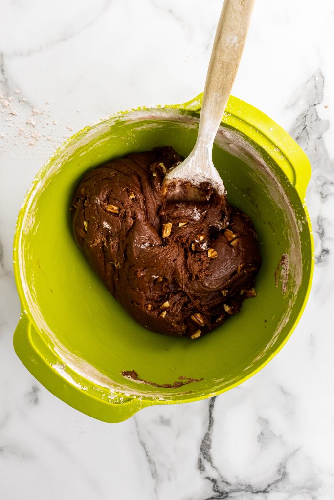 chocolate cheese fudge batter in a green mixing bowl