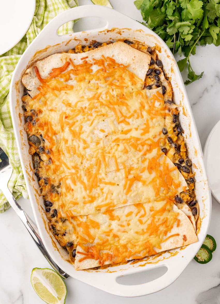 a baked cheesy tex mex lasagna in a white casserole dish