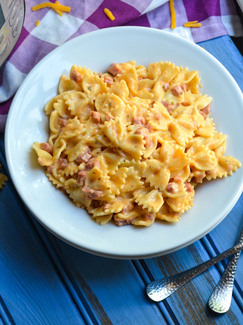 a white bowl filled with Instant Pot crack pasta with ham