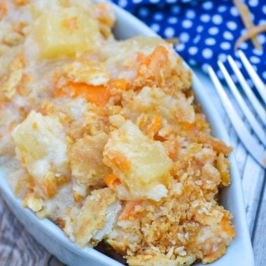 cheesy pineapple casserole in a light green bowl