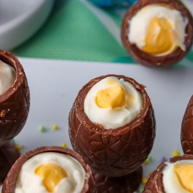 cheesecake stuffed chocolate Easter eggs on a white platter