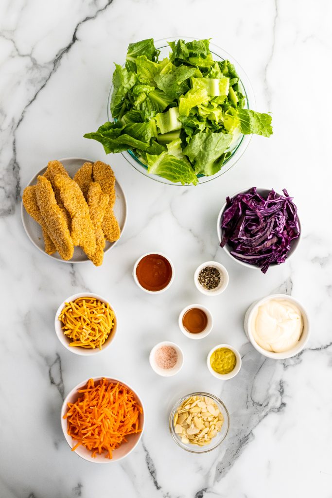 overhead image showing all of the measured ingredients needed to make a batch of oriental chicken salad