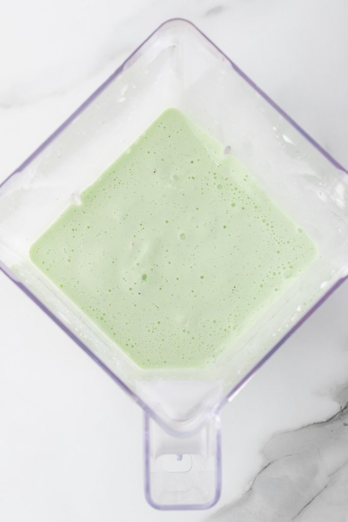 copycat shamrock shake ingredients blended into a smooth consistency in a blender