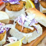 crab cake sliders on a wooden cutting board