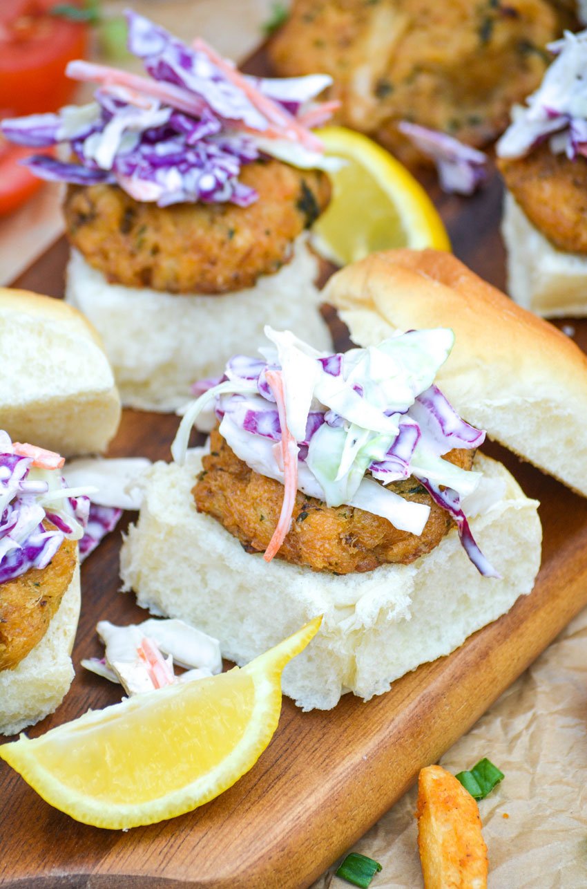 crab cake sliders on a wooden cutting board