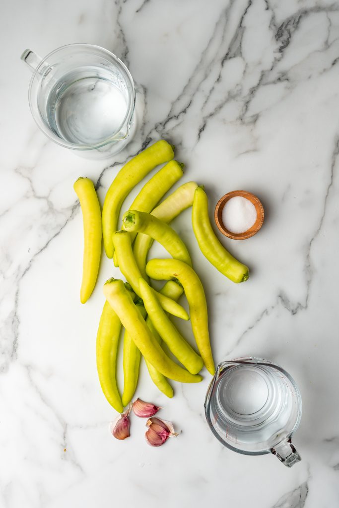 overhead image showing the measured ingredients needed to make a batch of pickled banana peppers