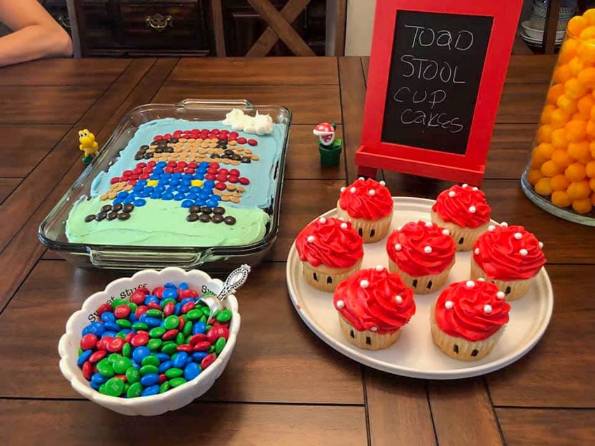 super mario birthday party foods on a wooden table