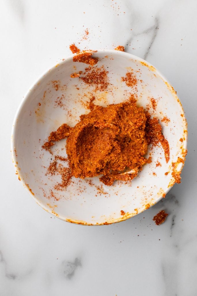 spiced butter chicken rub in a small white bowl
