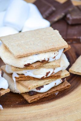 easy air fryer s'mores stacked together on a wooden cutting board