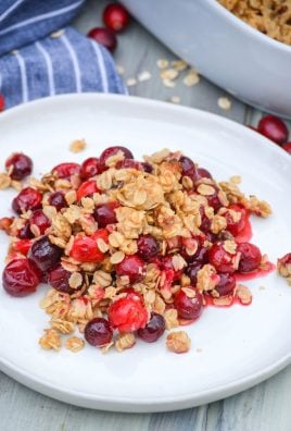 cranberry crisp with oatmeal crumble topping on a white plate