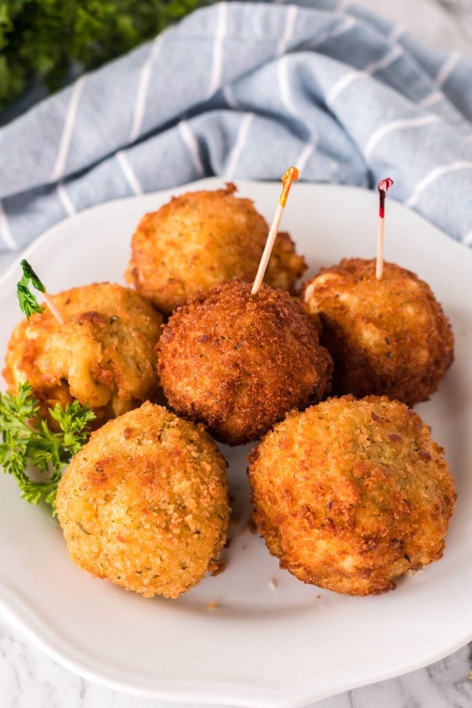copycat cheesecake factory fried mac and cheese balls on a white plate