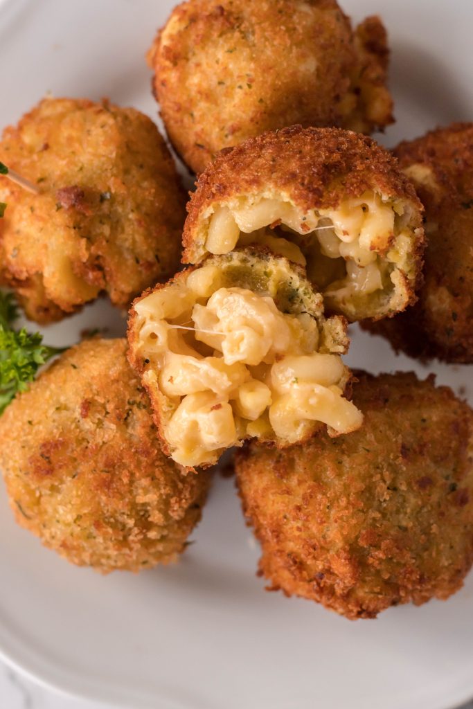fried mac and cheese balls on a white plate