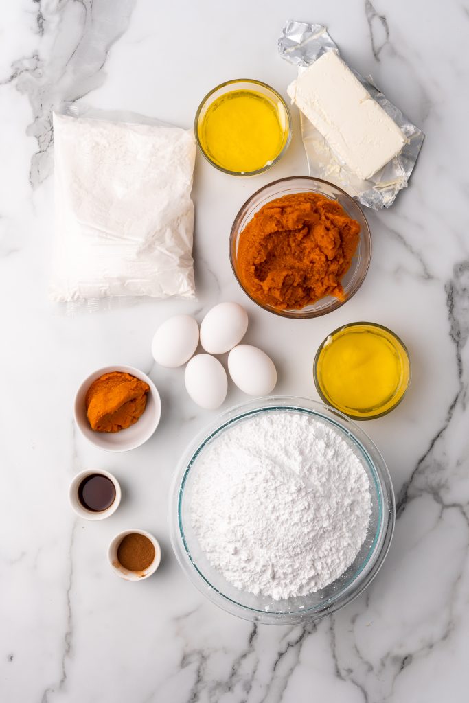 an overhead image showing the measured ingredients needed to make a batch of pumpkin butter gooey bars